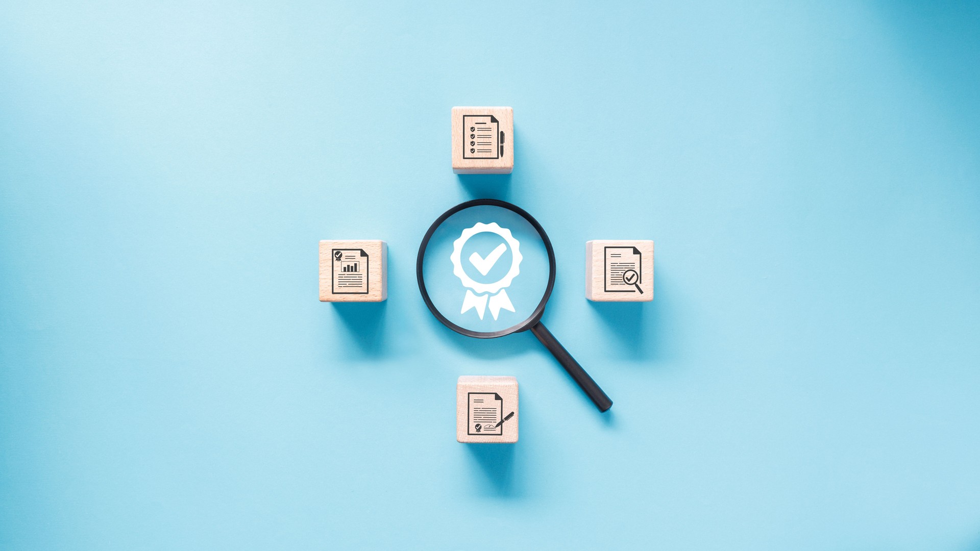 A magnifying glass is placed over certificate icon surround by set of wooden blocks with document verification icon in concept of examine and analyze document for quality control.